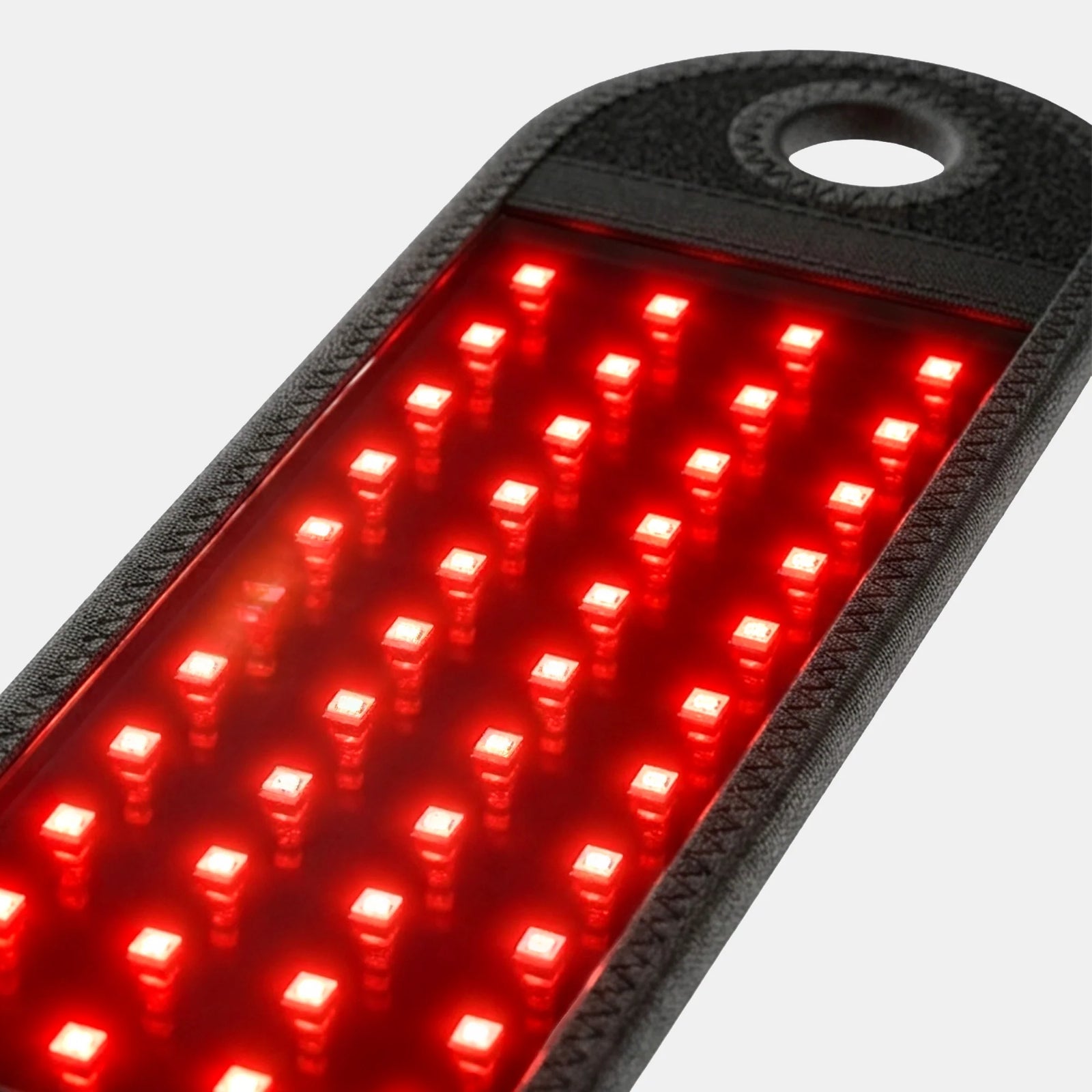 Extreme close-up of the red and near-infrared LED array glowing